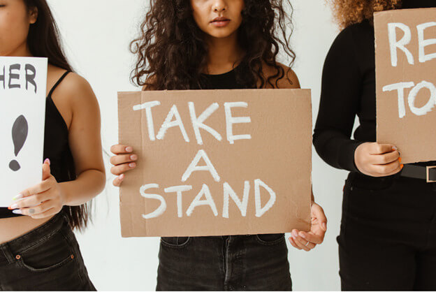 Girl holding sign Take a Stand